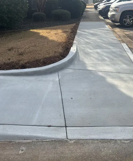 Curved concrete driveway extension with extra parking completed in Madison, AL